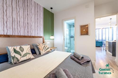 Кровать или кровати в номере Ático centro Huelva con parking