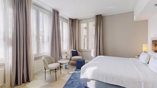 Ένα ή περισσότερα κρεβάτια σε δωμάτιο στο Radisson Blu Hotel Bremen