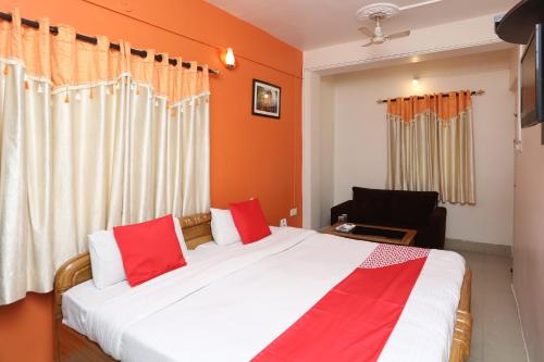 Ένα ή περισσότερα κρεβάτια σε δωμάτιο στο Hotel O New Mega Palace