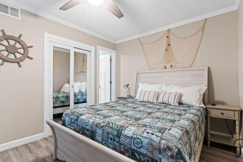 a bedroom with a bed and a mirror at ONE More Sandy Day - 2BR 2BA Beach Condo, Sleeps 6 in Myrtle Beach
