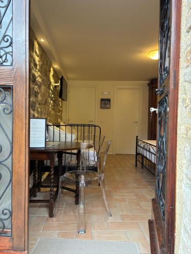 a dining room with a table and chairs at Torretta dependance in Assisi