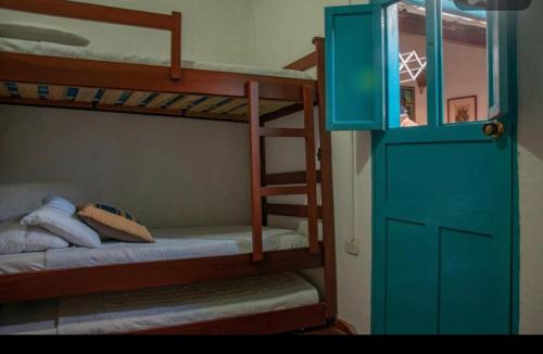 Una cama o camas en una habitación de Casa Laurel Y Tomillo