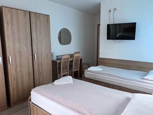 Postel nebo postele na pokoji v ubytování DW Belmara - Plaża Zachodnia - Ścieżka R10