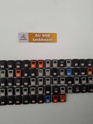 an air bike keyboard is sitting on a shelf at Golden Mango Heights - Urban Family Suite - One Bedroom Apartment - Restaurant, Workspace, City Views, Fast WiFi, Sauna, Fitness Facilities, Secure Parking And Kids Play Area in Nairobi