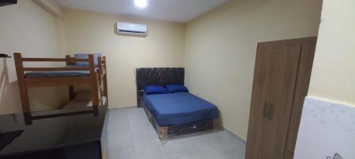 Ένα ή περισσότερα κρεβάτια σε δωμάτιο στο San Cosme Alojamiento