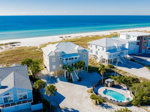 an aerial view of a house and the beach at Serenity Eden in Perdido Key