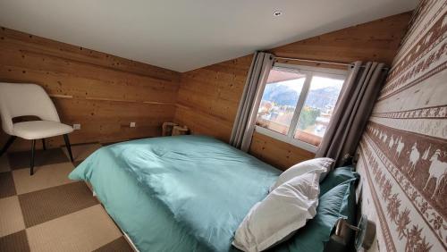 Postel nebo postele na pokoji v ubytování Appartement duplex 2Alpes centre