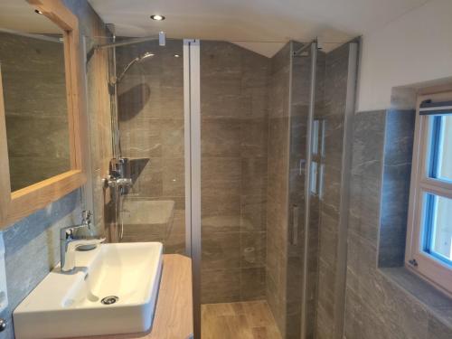 a bathroom with a sink and a shower at Zeffereralm in Forstau