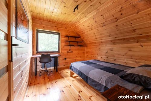 Postel nebo postele na pokoji v ubytování Leśny Wyraj