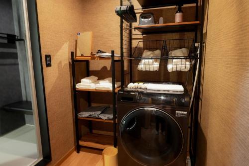 a washer and dryer in a room at Tabiudo Stay Miyajima 01-02 - Vacation STAY 20513 in Fukae