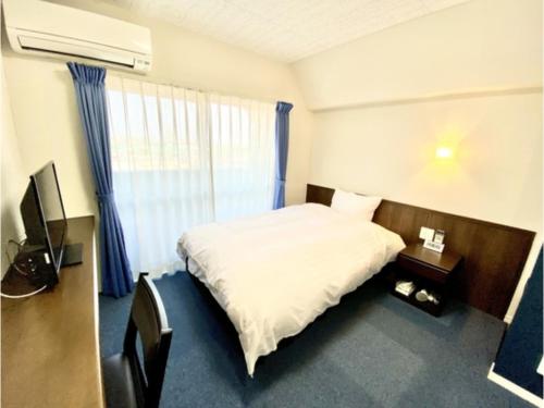 Кровать или кровати в номере Hotel Calm Place - Vacation STAY 64279v