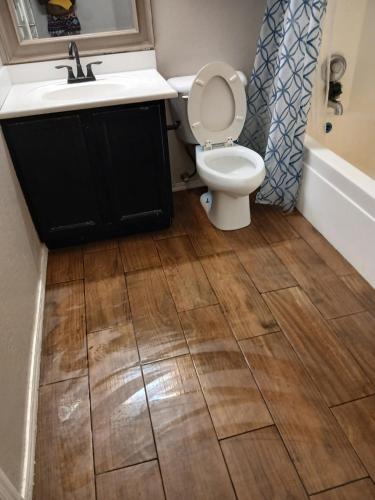 a bathroom with a sink and a toilet at West Valley Tiny Room Bennet in Phoenix