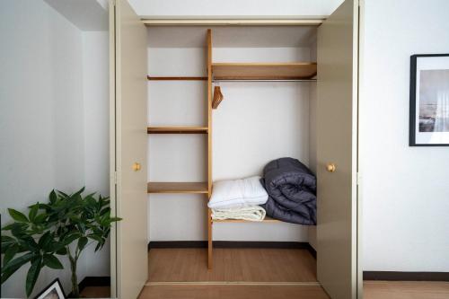 a small room with a bunk bed in it at Nakajima Park Mansion - Vacation STAY 20417 in Toyohira