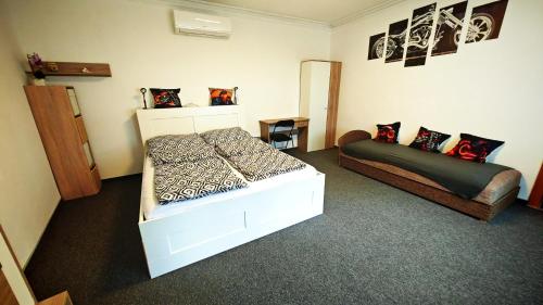 a bedroom with two beds in a room at Ezee Rider Apartmanok in Sárvár