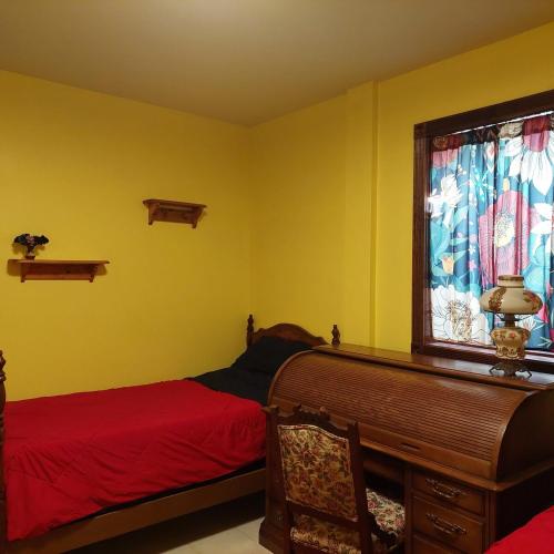 a bedroom with two beds and a window at Cirque Stay in Lawrence