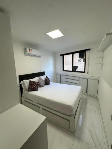 Ένα ή περισσότερα κρεβάτια σε δωμάτιο στο Boulevard Cabo Branco 204