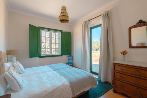 Giường trong phòng chung tại Villas Conde de Murça