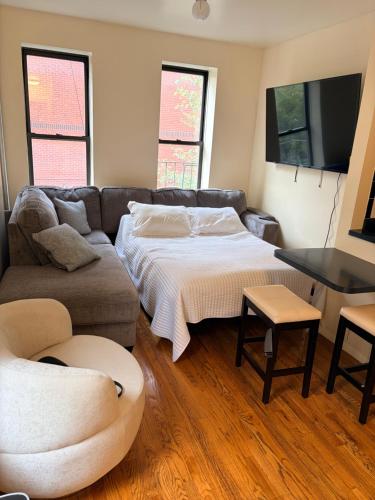 Ένα ή περισσότερα κρεβάτια σε δωμάτιο στο The Park Ave Studio