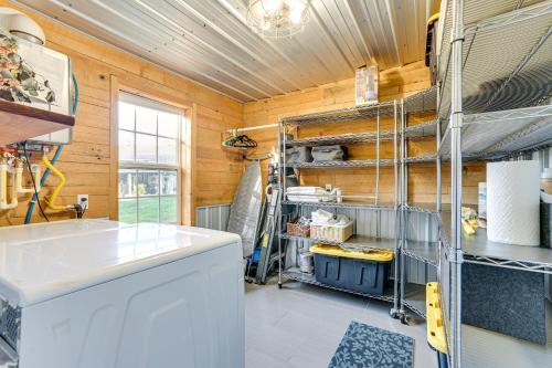 a kitchen with a counter and a sink in a room at Walk to Marina and Beach Charming Home in Hardin in Aurora