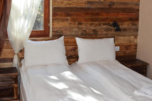 En eller flere senge i et værelse på Villa Pamporovo