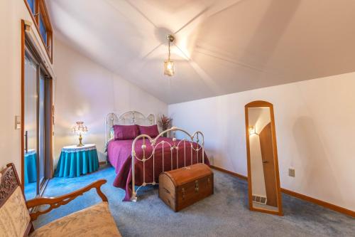 a bedroom with a bed and a mirror at Charming 3 bed 2 bath home near dunes, beach and trails in South Haven