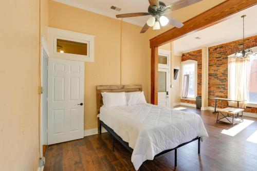 a bedroom with a bed and a ceiling fan at Pet-Friendly Studio in Historic Dtwn Marshall! in Marshall