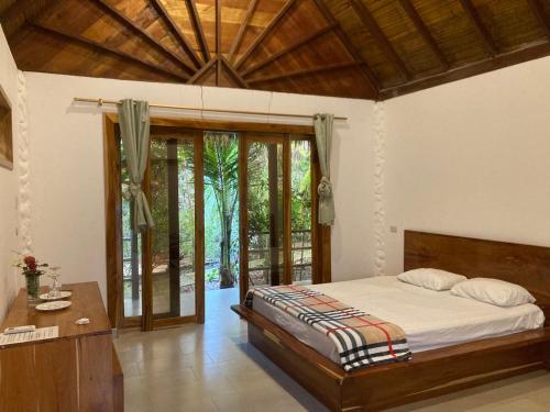 Ένα ή περισσότερα κρεβάτια σε δωμάτιο στο Hotel La Costa Internacional