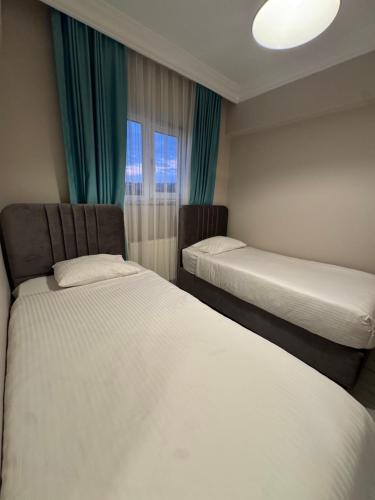 Ένα ή περισσότερα κρεβάτια σε δωμάτιο στο Baran House