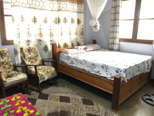 Postel nebo postele na pokoji v ubytování Rehoboth Homestay