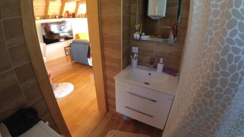 a bathroom with a sink and a mirror at Red Brick 