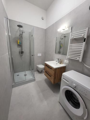 Koupelna v ubytování Apartamenty Kopernika41pl - parking, dostęp na kod, klimatyzacja, winda