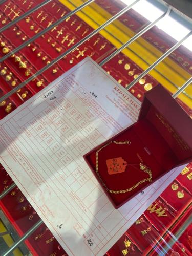 a piece of paper on a table with a passport at pina in Bintulu