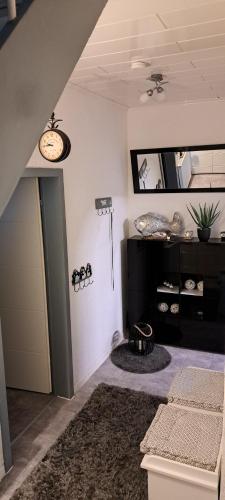 a living room with a door and a mirror at Schneeglöckchen in Marl