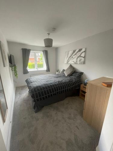 a bedroom with a bed and a window at Flat in Filton Mod Rolls Royce gkn in Bristol