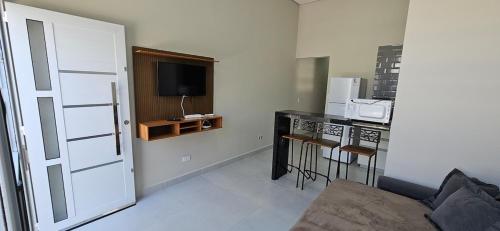 Køkken eller tekøkken på Casa Aconchegante com Suíte, Ar-Condicionado e Wi-Fi e garagem