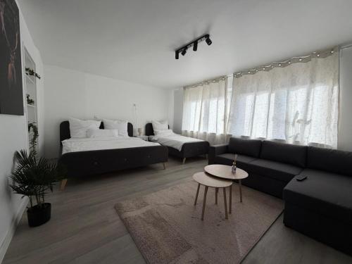 Postel nebo postele na pokoji v ubytování Cataleya Apartament