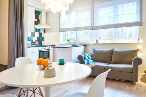 a living room with a table and a couch at Studio Praga in Warsaw