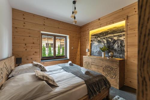 Postel nebo postele na pokoji v ubytování Apartament nad jeziorem, Czorsztyn - Kluszkowce