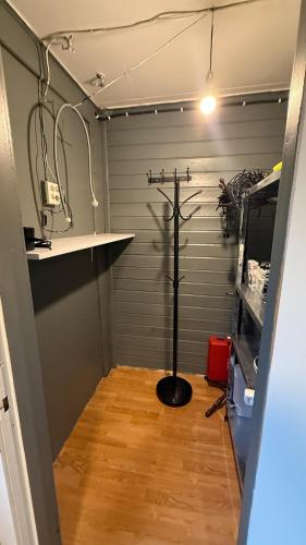 a room with a metal cross in a garage at Myrvoll trails og view in Lakselvbukt