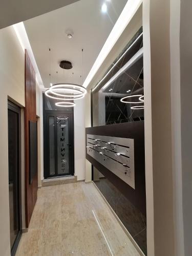 a hallway with a walk in closet with wine racks at Apartman Vaske 2 sa GARAŽOM in Brčko
