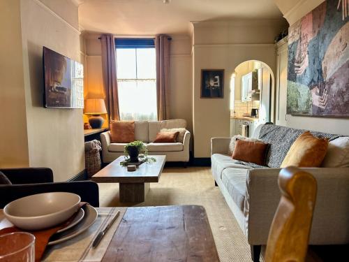 a living room with a couch and a table at NEW! Stylish Chester Townhouse, Sleeps 6 in Chester