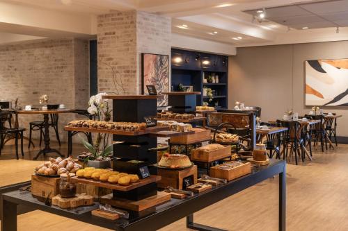 a bakery with a display of food on a table at Blue Tree Premium Florianópolis in Florianópolis