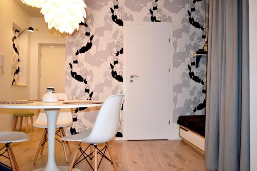 a dining room with a table and chairs at Studio Praga in Warsaw