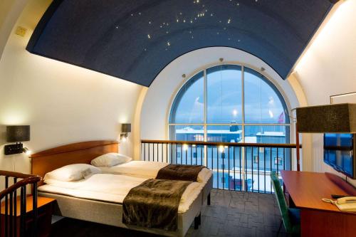 Postel nebo postele na pokoji v ubytování Scandic Harstad