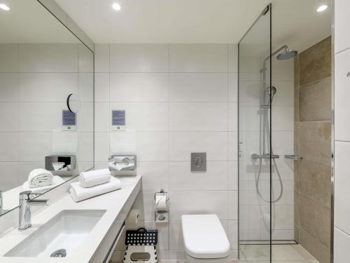 a bathroom with a shower and a sink and a toilet at ibis Styles Bamberg in Bamberg
