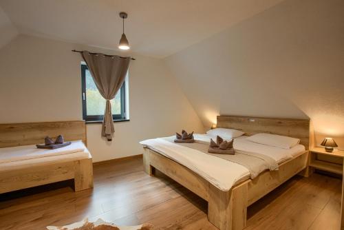 Postel nebo postele na pokoji v ubytování Resort Biela Skala - CHATA Chopok Jasná Juh