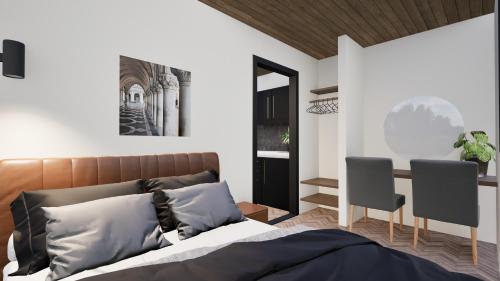 ポールトン・ル・フィルドにあるStaining Luxury Lodgesのベッドと椅子2脚のある寝室