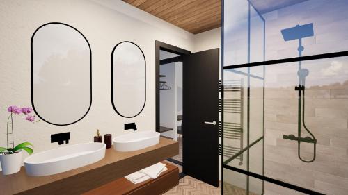 ポールトン・ル・フィルドにあるStaining Luxury Lodgesの洗面台が2つと鏡が2つあるバスルーム