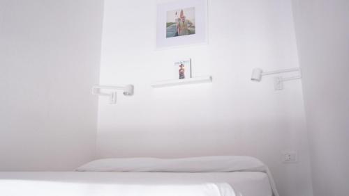 Postel nebo postele na pokoji v ubytování The Tiny Studio Firenze