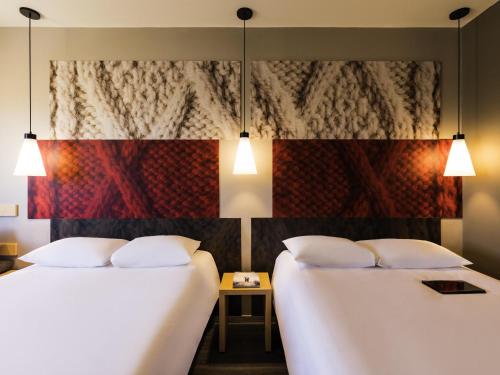 Ένα ή περισσότερα κρεβάτια σε δωμάτιο στο Ibis Torreon